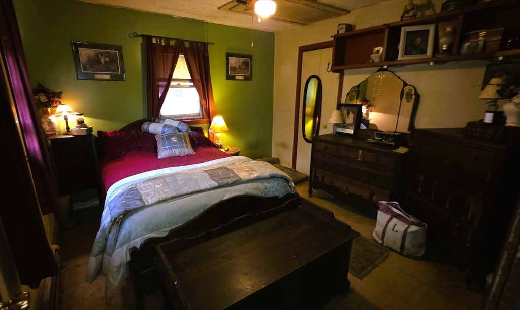 7 Hog Hollow Road Buckland, MA 01338 - Photo 16 of 22 a bed sitting in a bedroom next to a window
