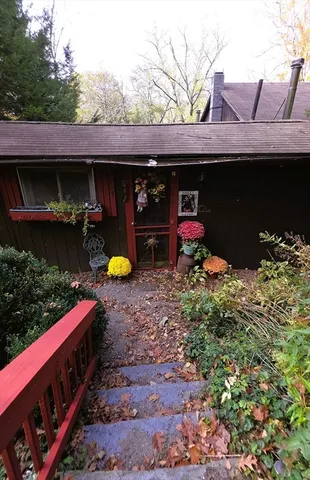 a view of a back yard the patio and fire pit