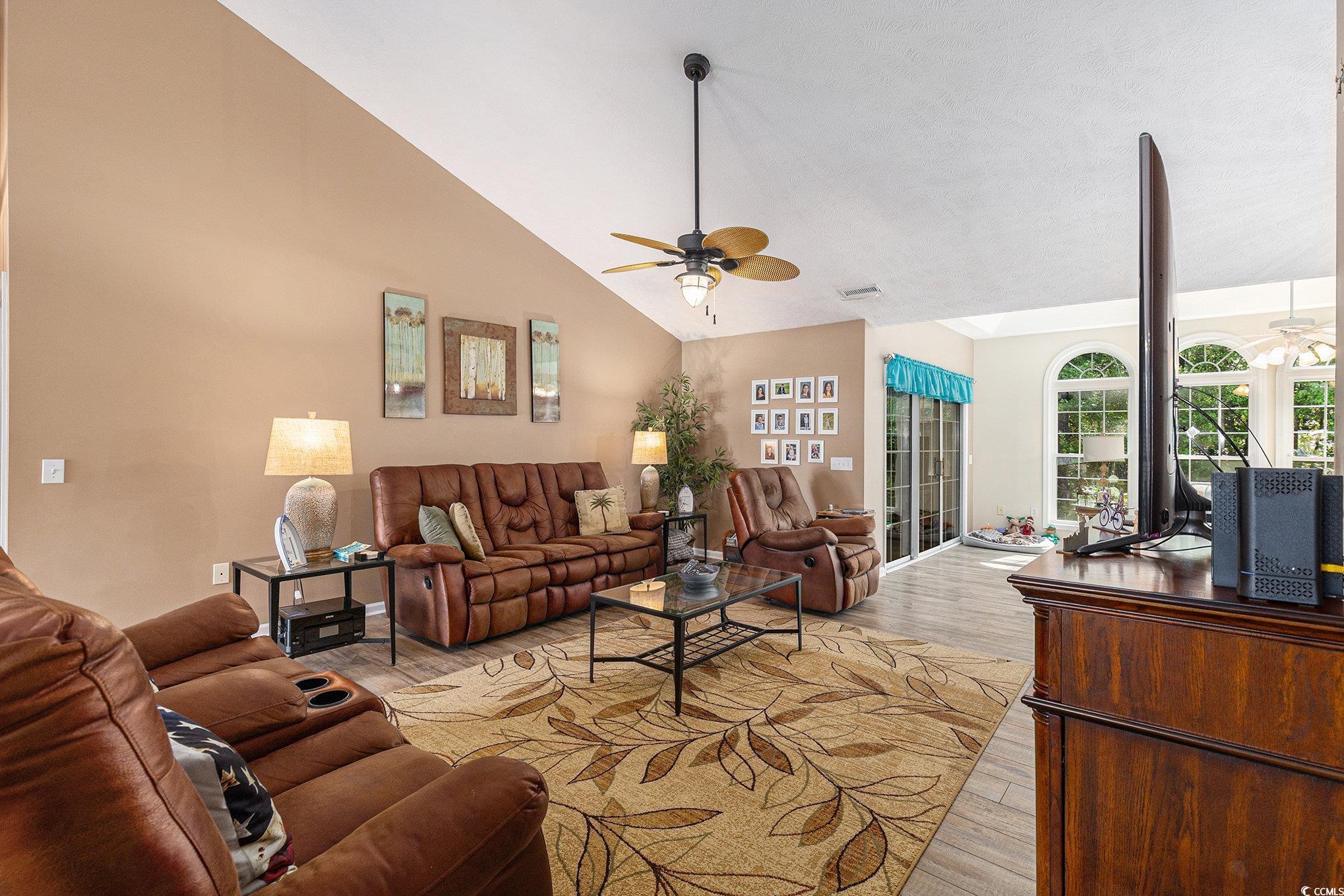 1105 Lampwick Lane Murrells Inlet, SC 29576 - Photo 12 of 40 Living area with a ceiling fan, vaulted ceiling, a