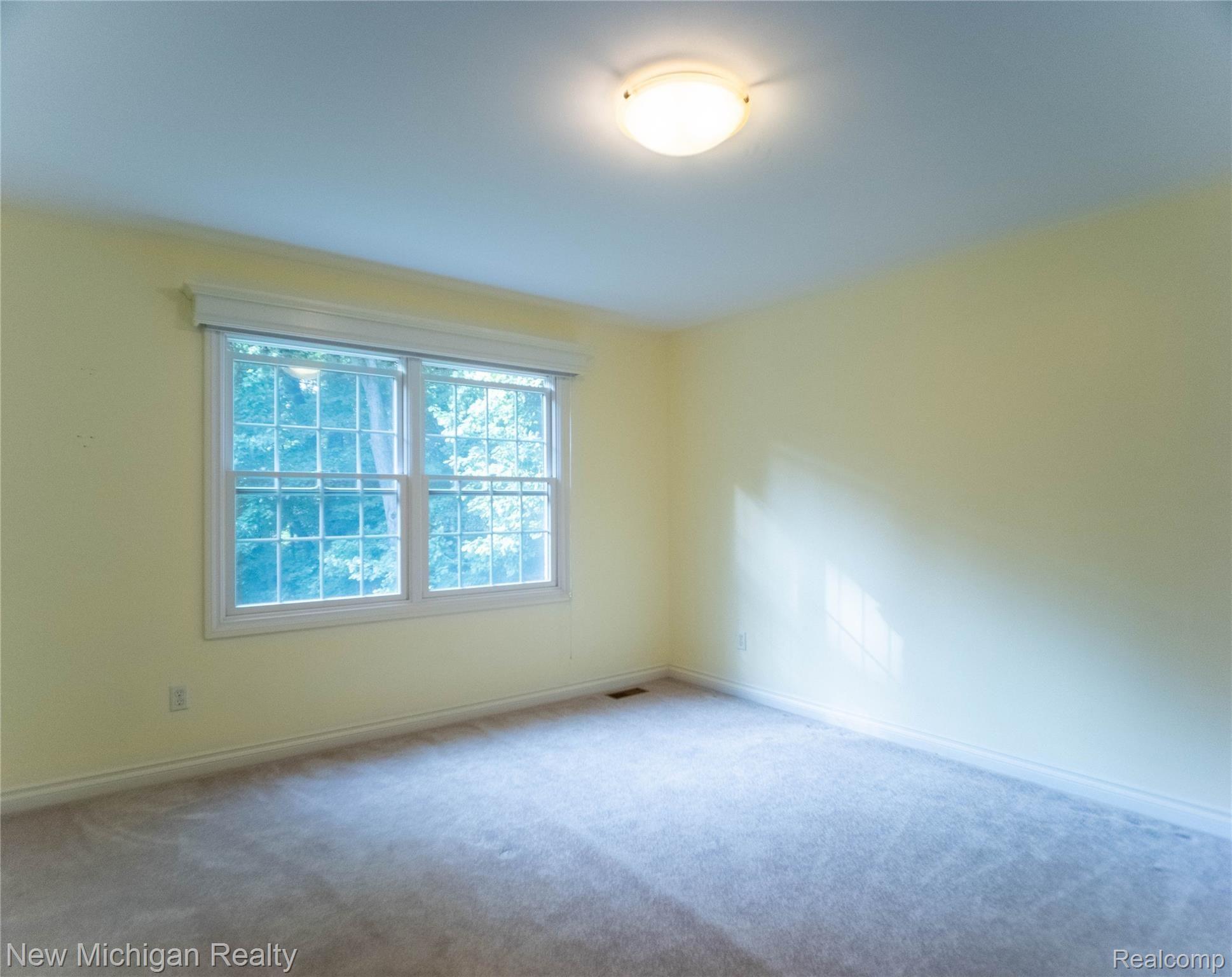 724 Lakeville Road Leonard, MI 48367 - Photo 24 of 31 P1011141-HDR empty bedroom 2.jpg