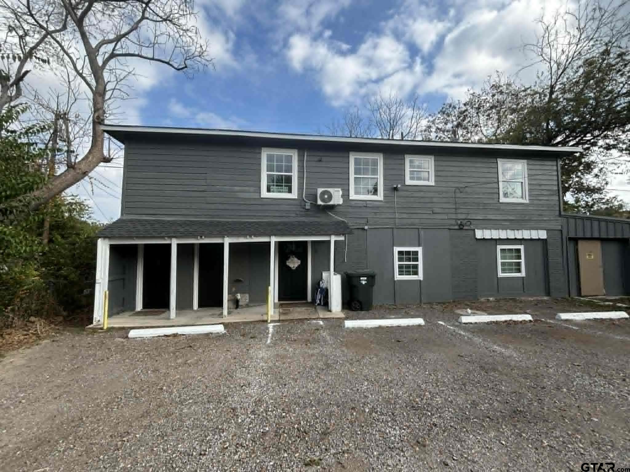 1511 Summit Avenue, Unit 3 Tyler, TX 75702 - Photo 1 of 8 a house with a outdoor space