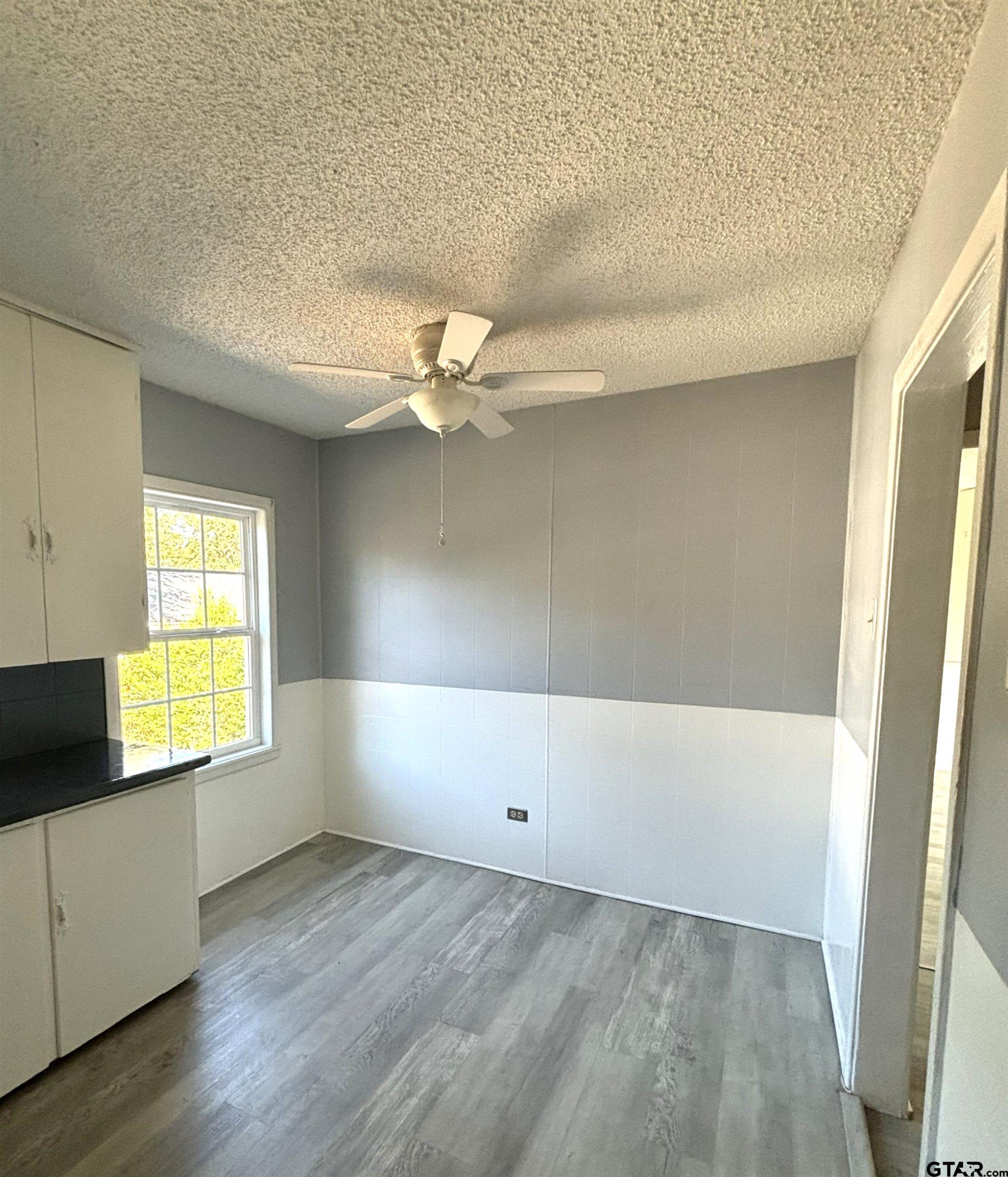 1511 Summit Avenue, Unit 3 Tyler, TX 75702 - Photo 4 of 8 a view of an empty room and a window