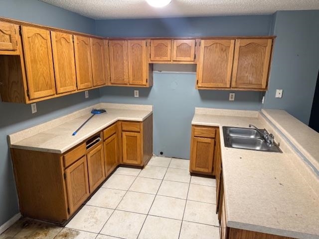 5407 Riverdale Road Memphis, TN 38141 - Photo 3 of 8 a kitchen with a sink a stove top oven and cabinets