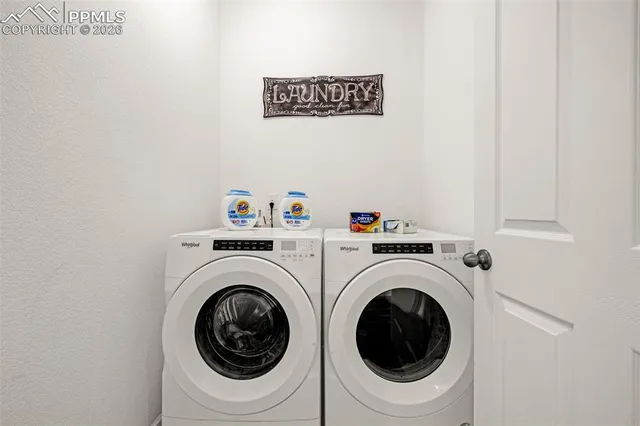 a utility room with dryer and washer