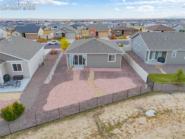 a aerial view of a house with a ocean view