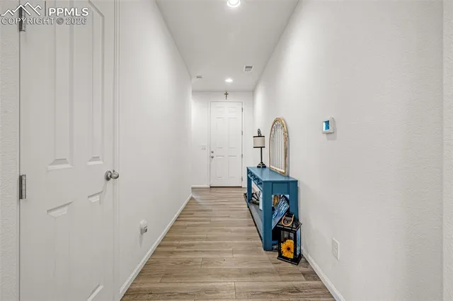 a room with a table and a chandelier