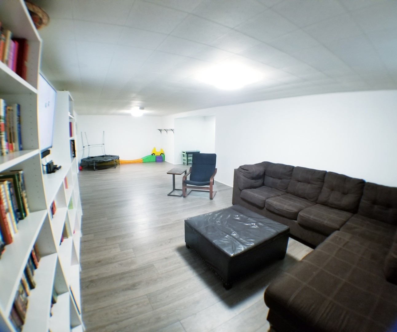 85 River Bluff Road Elgin, IL 60120 - Photo 25 of 26 a living room with furniture and a flat screen tv