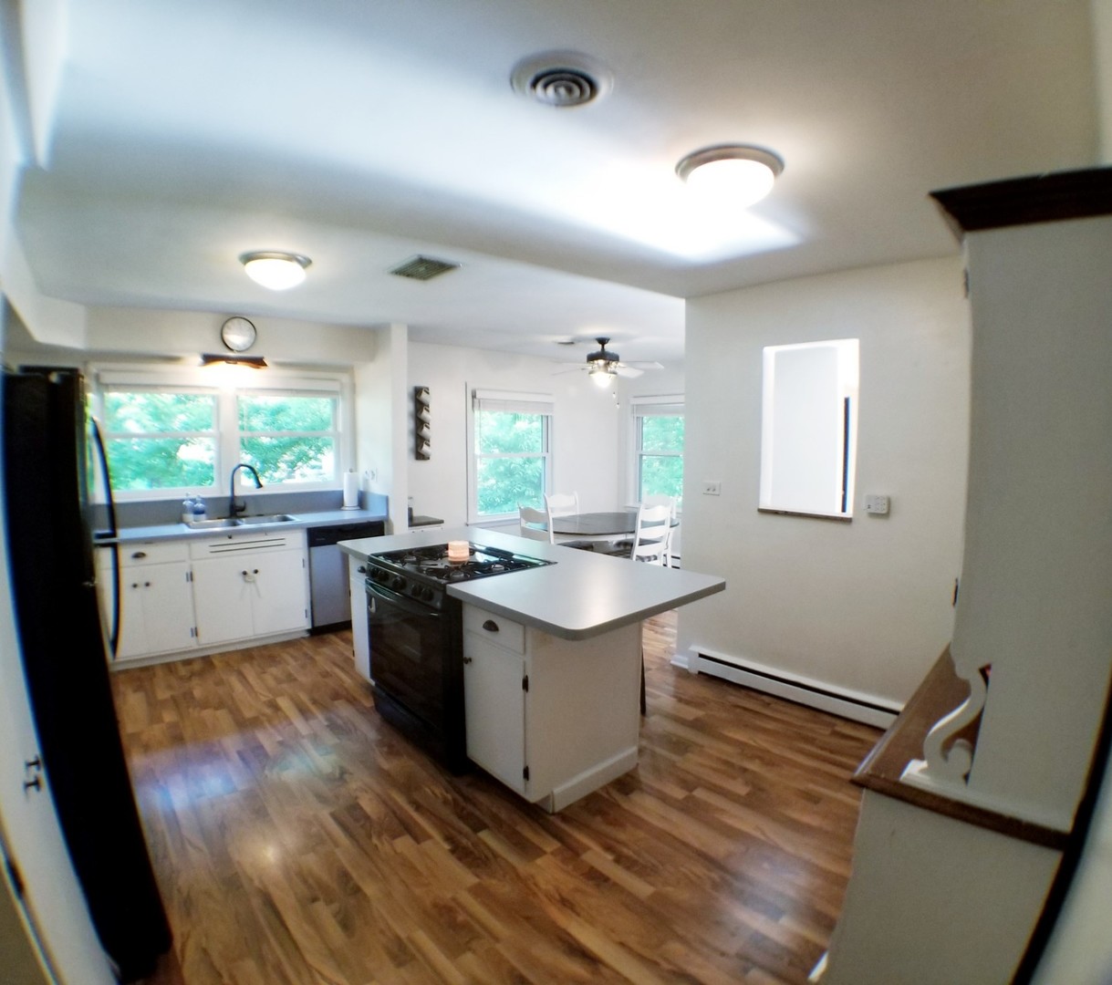 85 River Bluff Road Elgin, IL 60120 - Photo 10 of 26 a kitchen with a sink window and cabinets