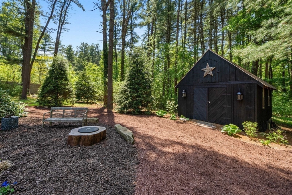 49 Walpole Street Dover, MA 02030 - Photo 33 of 40 a backyard of a house with lots of green space