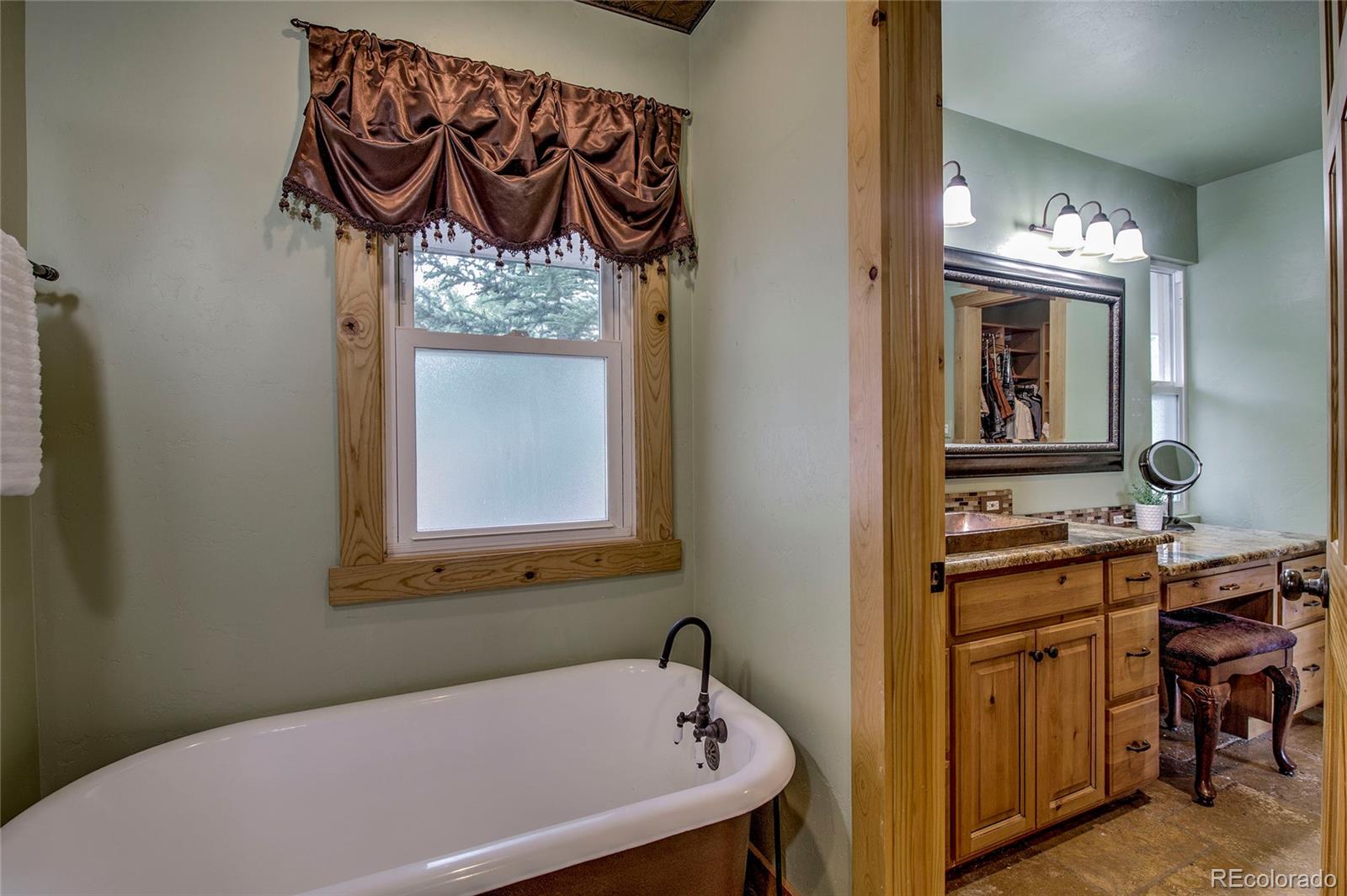42 Aa Road Silverthorne, CO 80498 - Photo 4 of 50 a bathroom with a bathtub and a sink