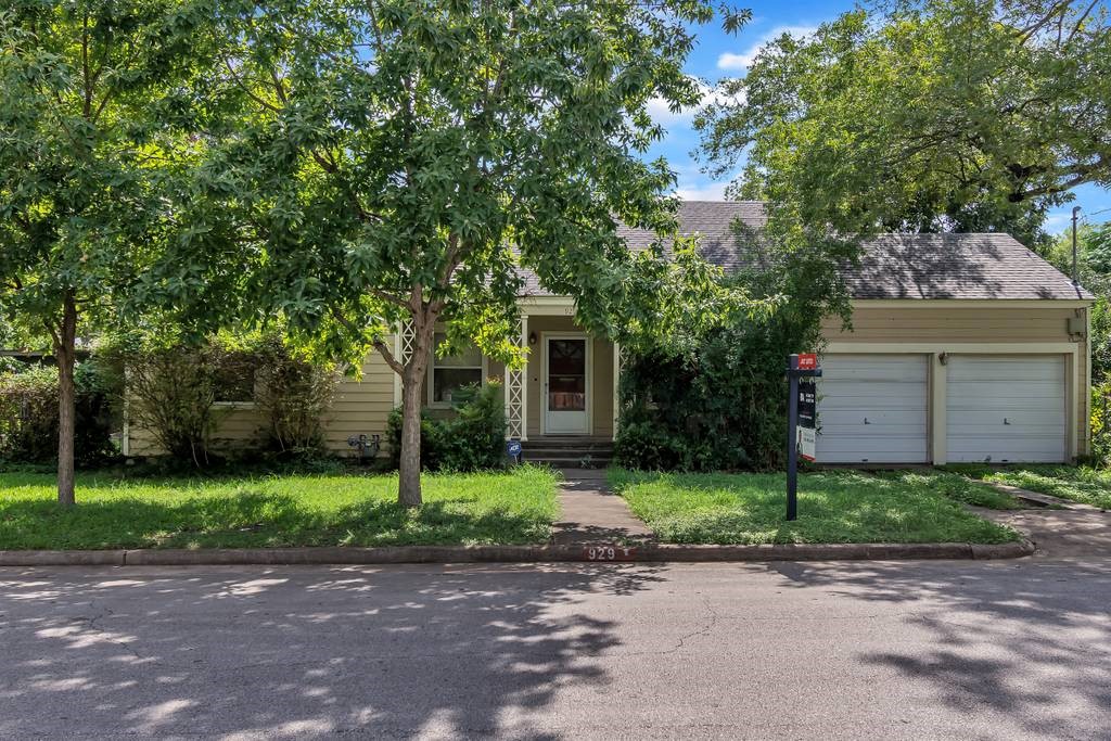 929 East 52nd Street Austin, TX 78751 - Photo 1 of 1 a front view of a house with a yard and a garage
