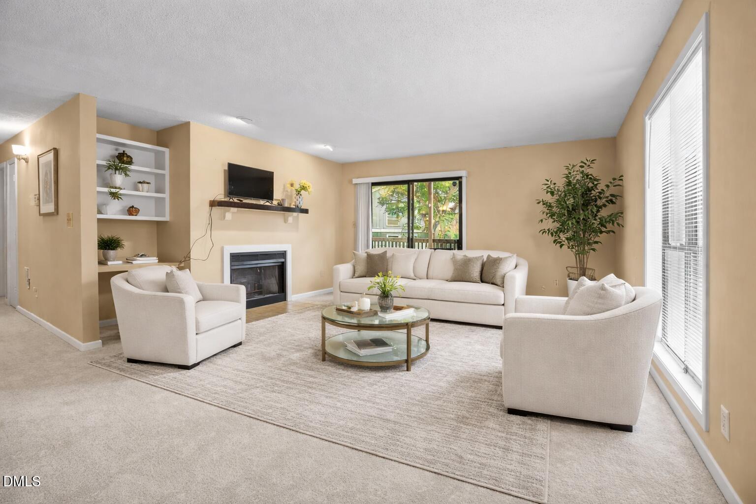 5816 Pointer Drive, Unit 102 Raleigh, NC 27609 - Photo 3 of 15 Elegant living room by the fireplace