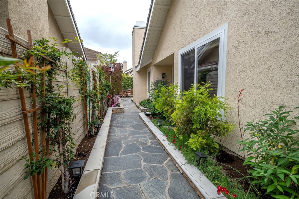 19 Windsong Irvine, CA 92614 - Photo 11 of 46 a view of a pathway with house on both side