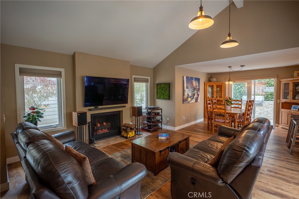 19 Windsong Irvine, CA 92614 - Photo 13 of 46 a living room with furniture a flat screen tv and a large window