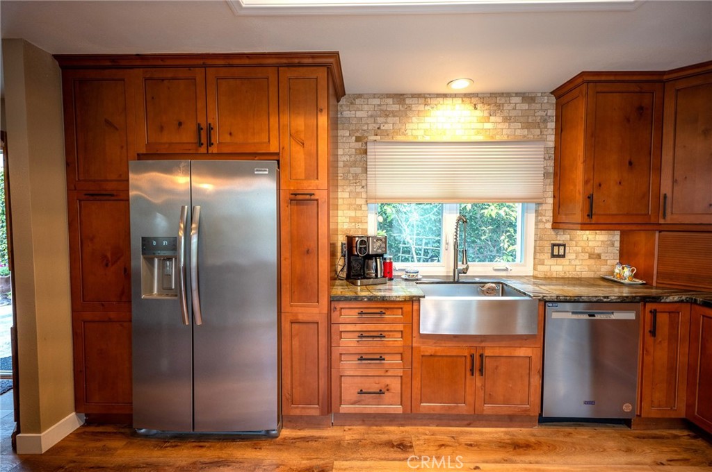 19 Windsong Irvine, CA 92614 - Photo 24 of 46 a kitchen with stainless steel appliances granite countertop a refrigerator and a sink