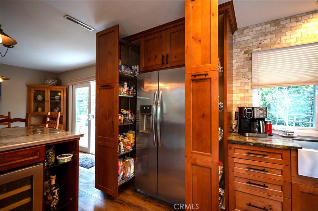 19 Windsong Irvine, CA 92614 - Photo 26 of 46 a kitchen with stainless steel appliances granite countertop a refrigerator and a sink