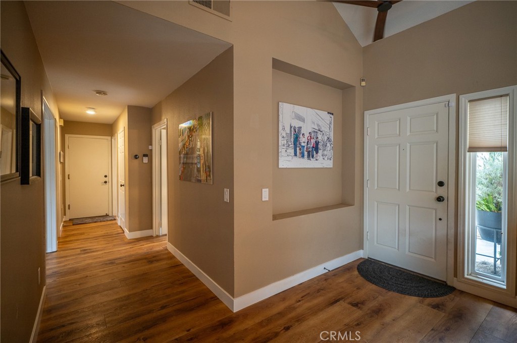 19 Windsong Irvine, CA 92614 - Photo 27 of 46 a view of a hallway with wooden floor