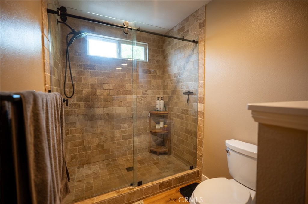 19 Windsong Irvine, CA 92614 - Photo 34 of 46 a bathroom with a shower and toilet