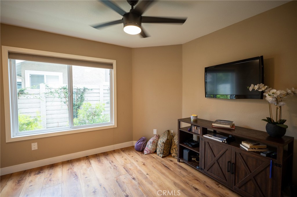 19 Windsong Irvine, CA 92614 - Photo 35 of 46 a bedroom with a bed and a flat tv screen on the dresser