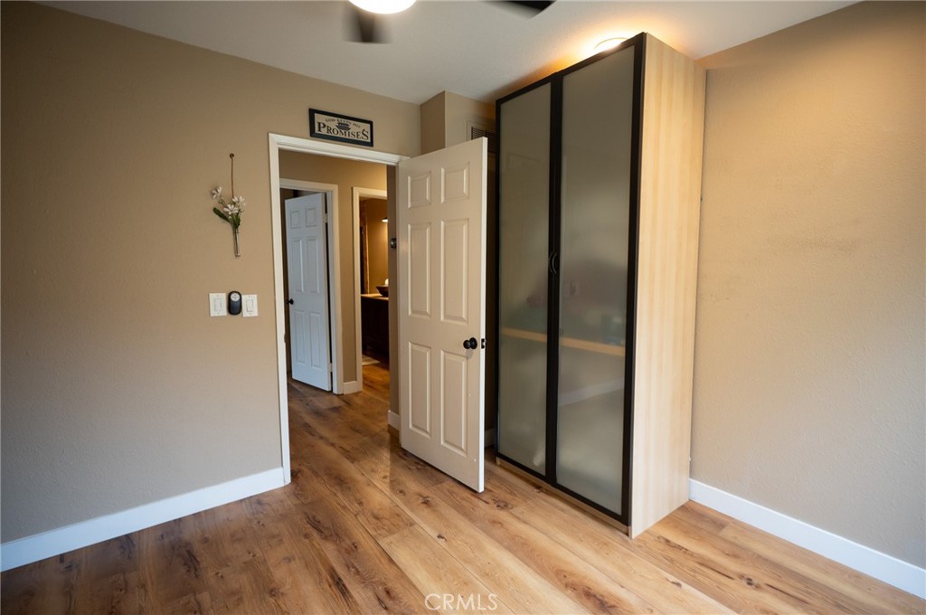 19 Windsong Irvine, CA 92614 - Photo 36 of 46 a view of a hallway with wooden floor
