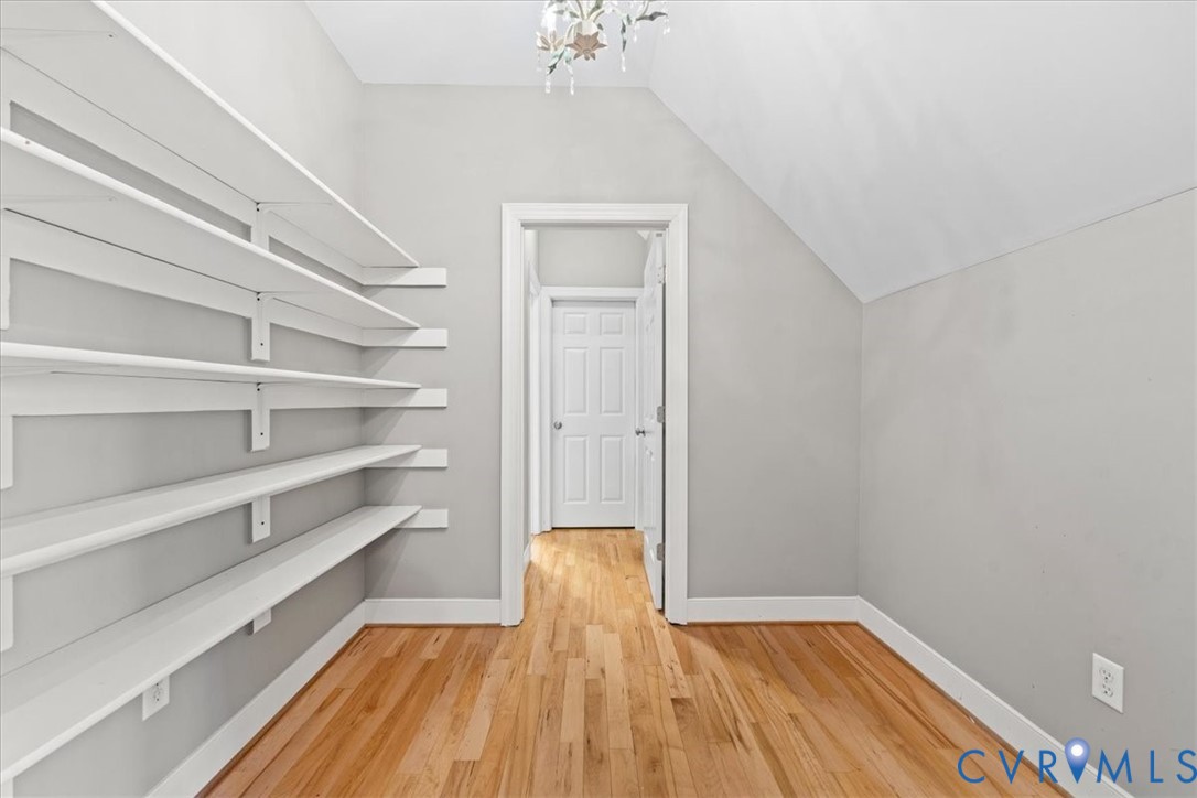 3308 Yarding Way Toano, VA 23168 - Photo 57 of 83 a view of a room with wooden floor and a chandelier
