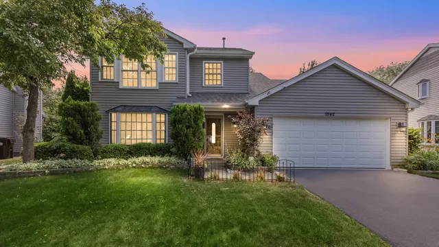 front view of a house with a yard