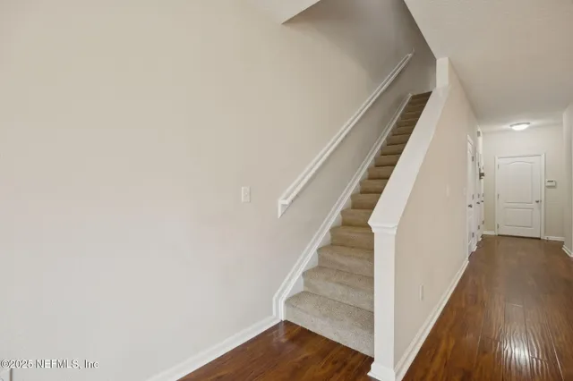 a view of entryway with wooden floor