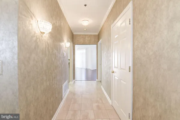 a view of a bathroom from a hallway