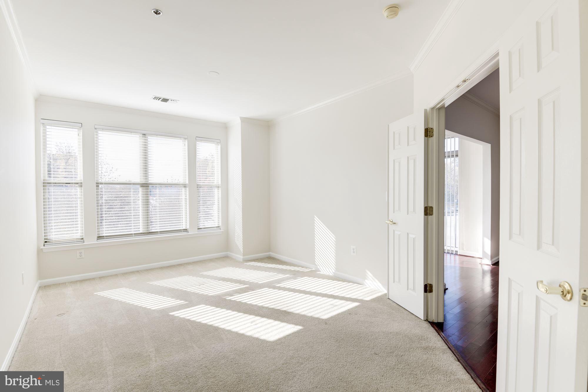 1860 Stratford Park Place, Unit 204 Reston, VA 20190 - Photo 21 of 41 a view of an empty room with a window