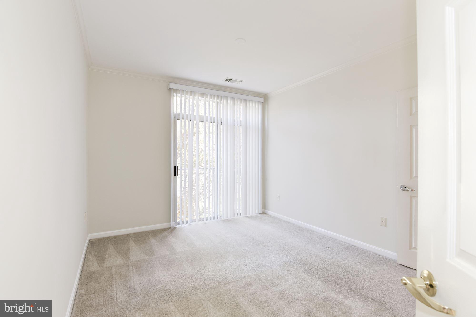 1860 Stratford Park Place, Unit 204 Reston, VA 20190 - Photo 27 of 41 a view of an empty room with a window