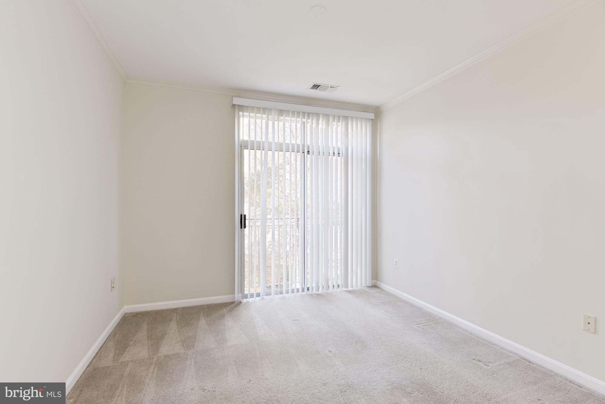 1860 Stratford Park Place, Unit 204 Reston, VA 20190 - Photo 28 of 41 an empty room with windows