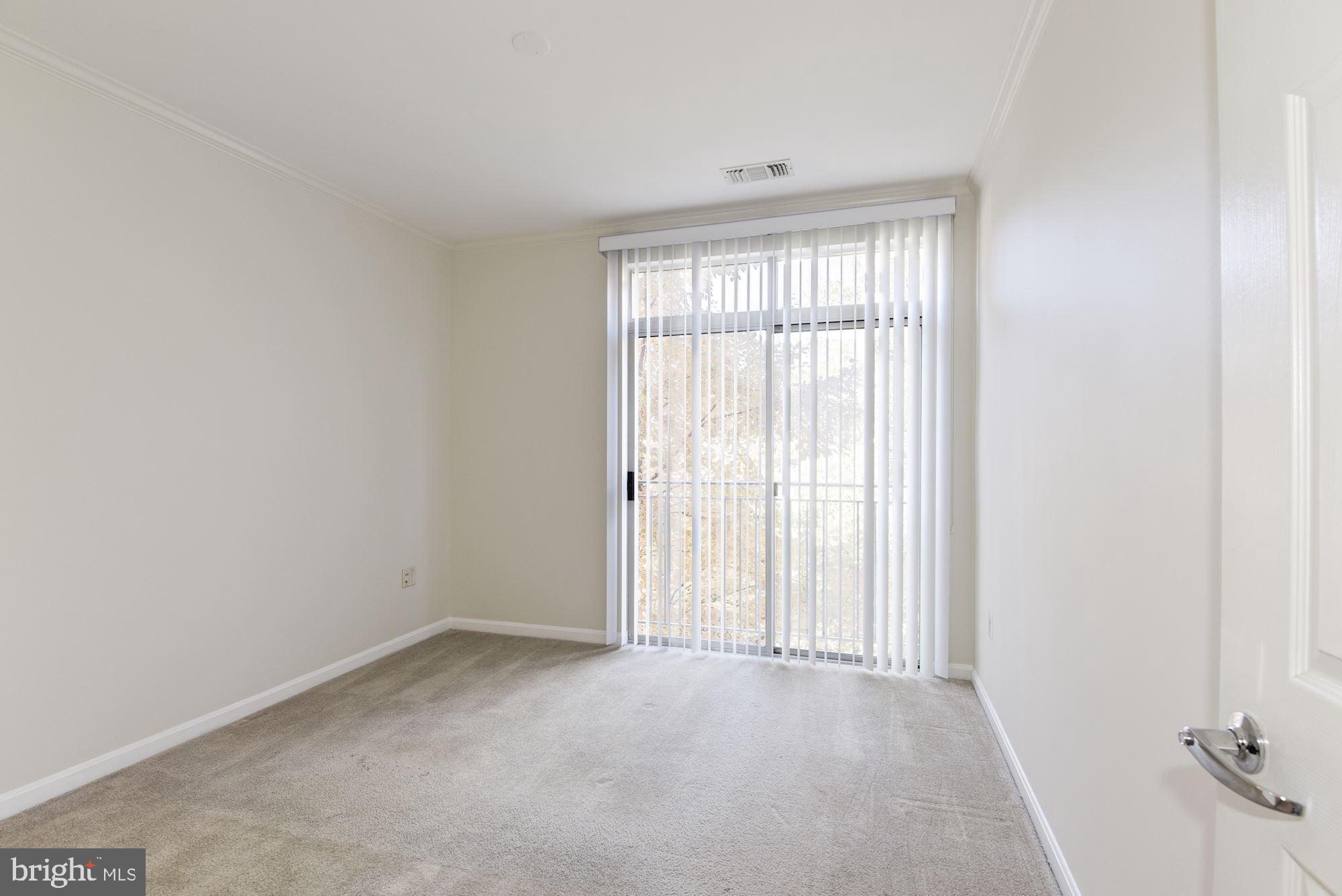 1860 Stratford Park Place, Unit 204 Reston, VA 20190 - Photo 29 of 41 an empty room with a window