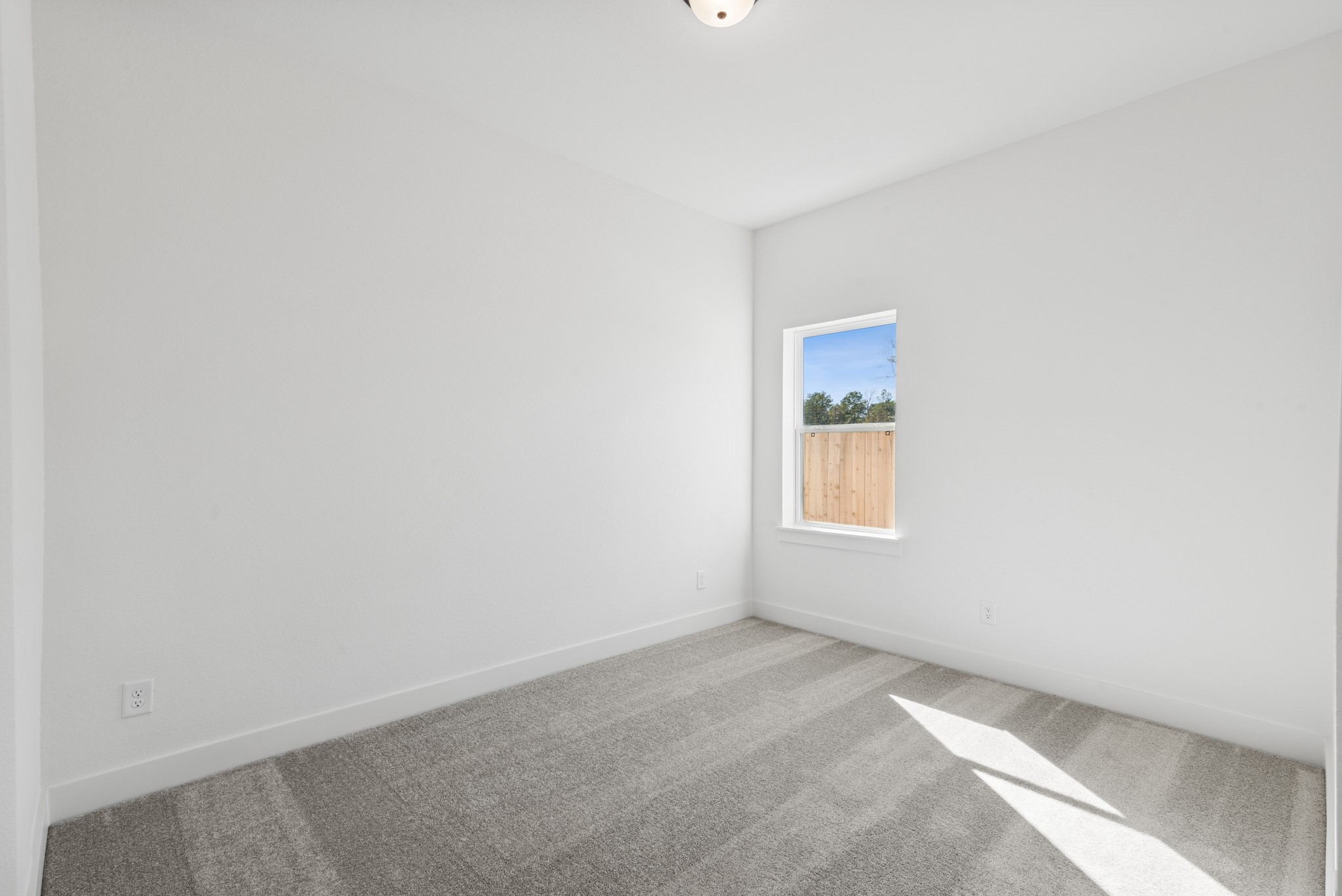 16138 Rita Road Conroe, TX 77302 - Photo 23 of 50 a view of an empty room with a window