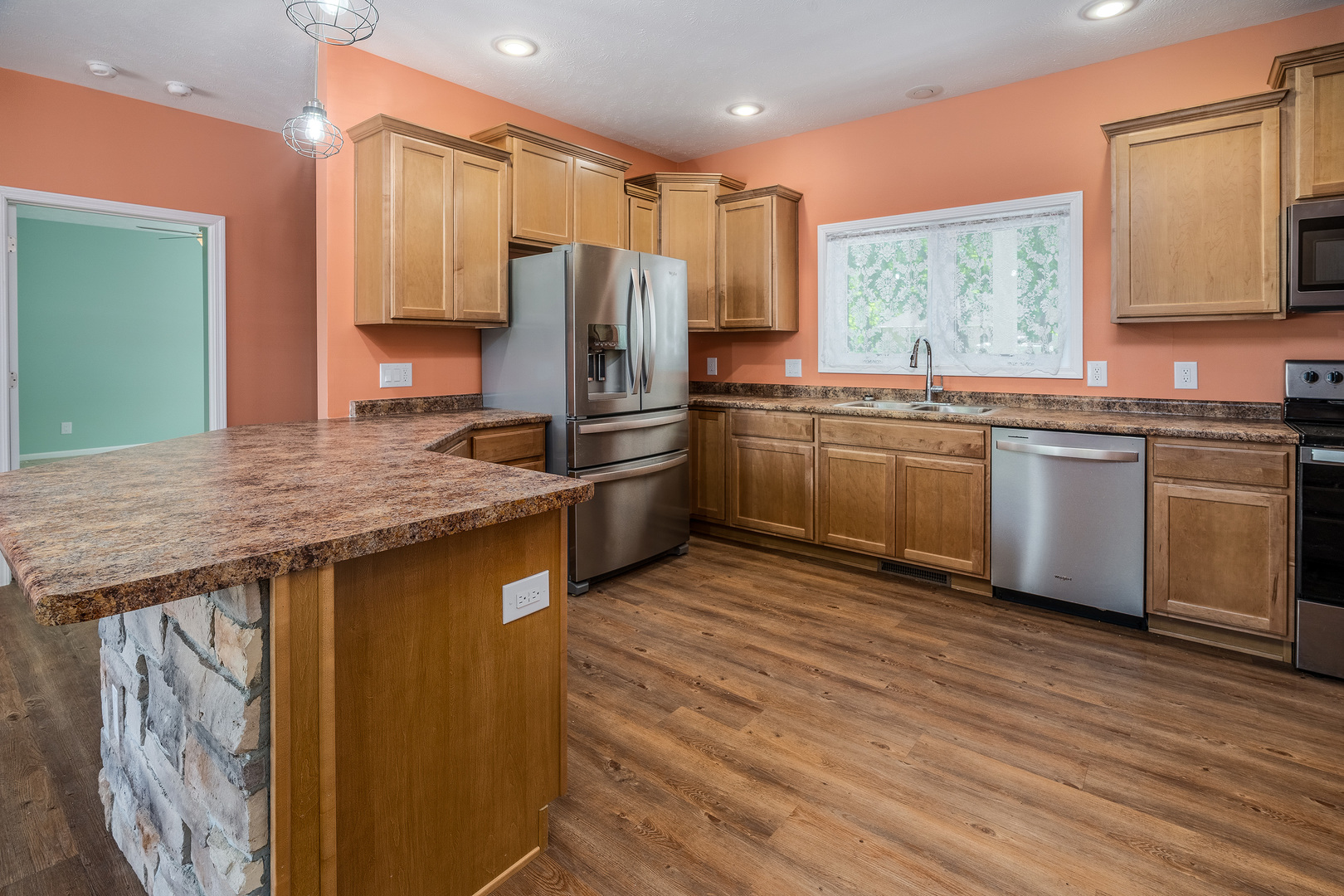 18562 East Hill Street Mount Vernon, IL 62864 - Photo 9 of 43 a kitchen with stainless steel appliances granite countertop a stove refrigerator sink and microwave