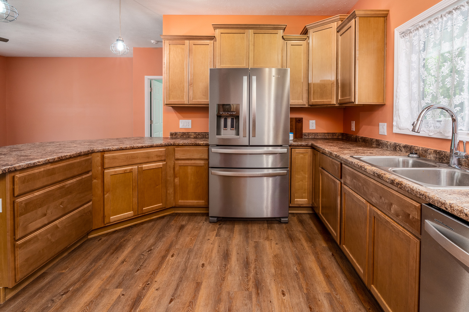18562 East Hill Street Mount Vernon, IL 62864 - Photo 10 of 43 a kitchen with stainless steel appliances granite countertop a refrigerator a sink dishwasher a stove with wooden floor