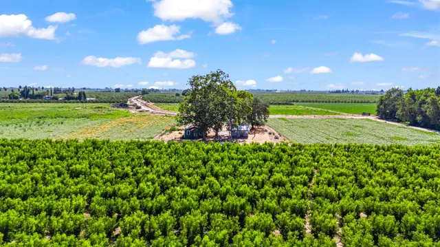 a view of a golf course with an outdoor space