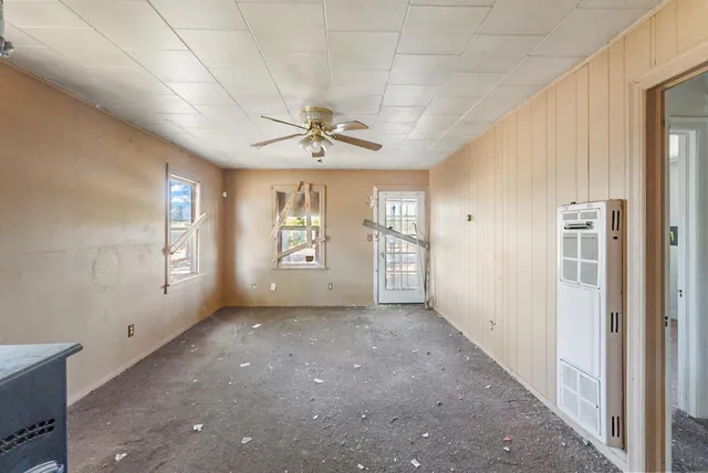 a view of a kitchen with a sink and cabinets