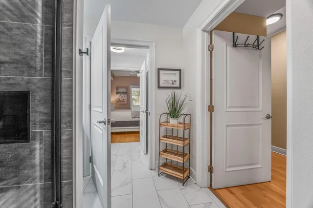 a bathroom with a shower and a mirror