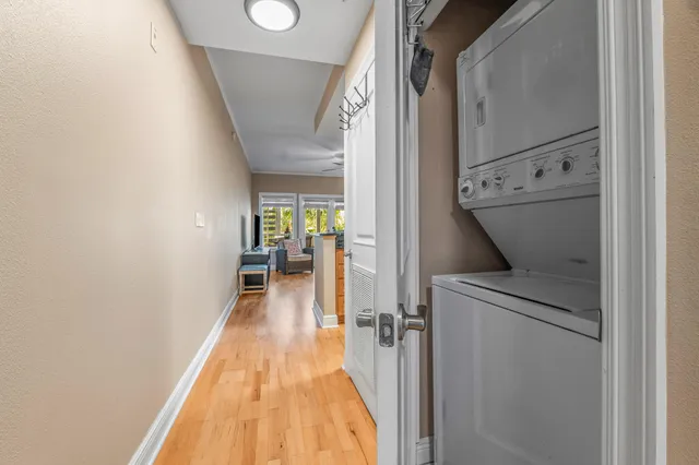 a view of hallway with wooden floor