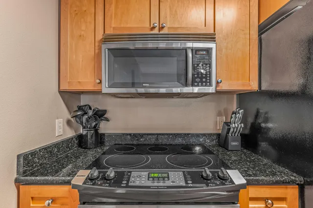a kitchen with a stove and a microwave