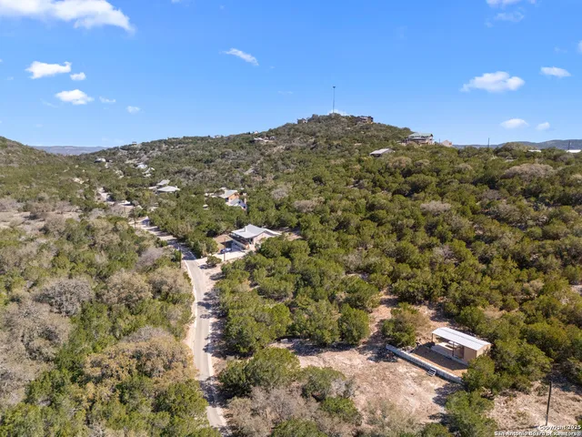a view of a large building with a mountain in the background