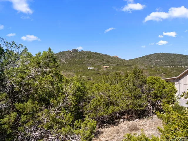 a view of yard covered with snow in front of house
