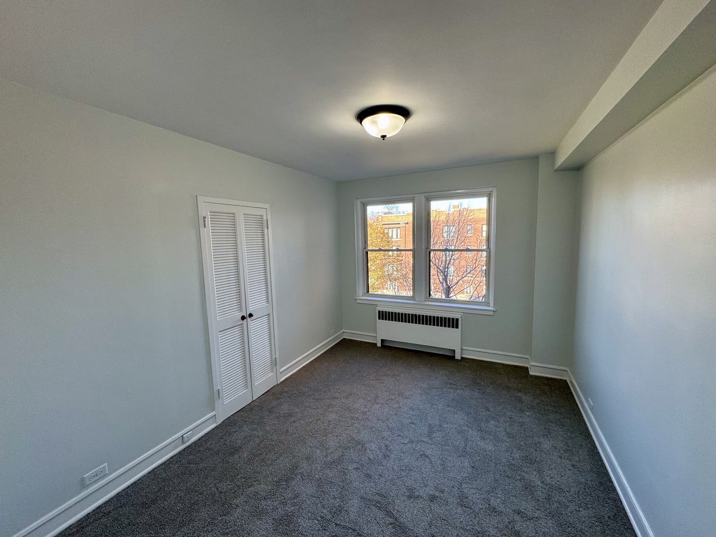 1585 Ridge Avenue, Unit 301 Evanston, IL 60201 - Photo 21 of 29 an empty room with a window