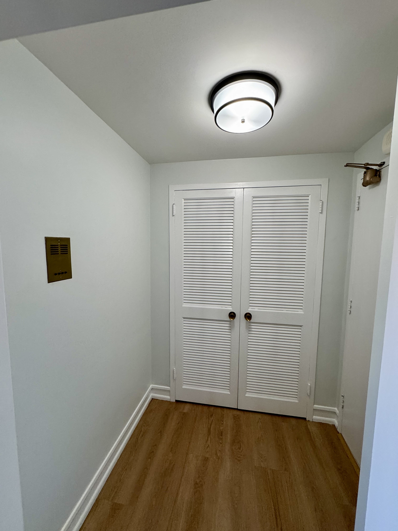 1585 Ridge Avenue, Unit 301 Evanston, IL 60201 - Photo 4 of 29 a view of a room with wooden floor and white walls