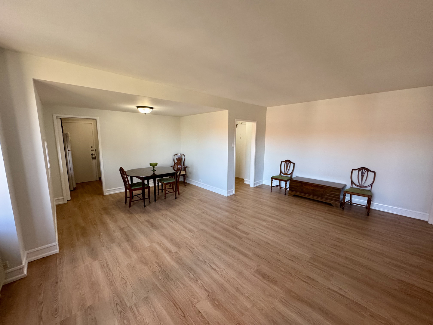 1585 Ridge Avenue, Unit 301 Evanston, IL 60201 - Photo 6 of 29 a view of a room with furniture and wooden floor