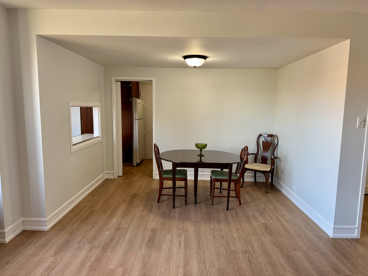 1585 Ridge Avenue, Unit 301 Evanston, IL 60201 - Photo 8 of 29 a dining room with furniture and wooden floor