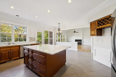 a kitchen with stainless steel appliances a refrigerator and a stove