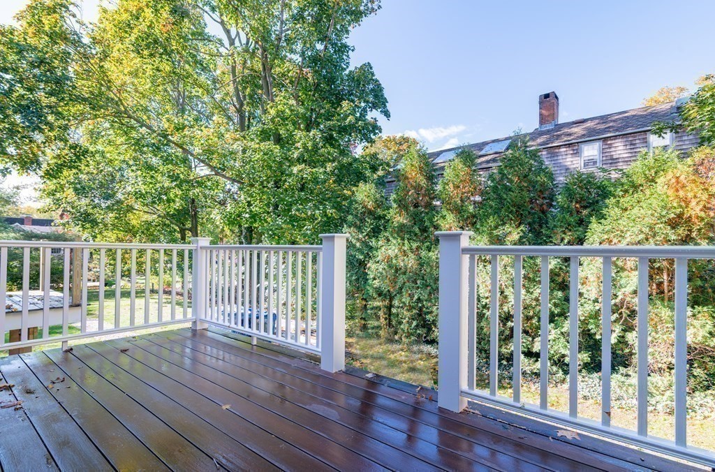 5 Pleasant Street, Unit 3 Hingham, MA 02043 - Photo 18 of 25 a view of a deck with wooden floor and fence