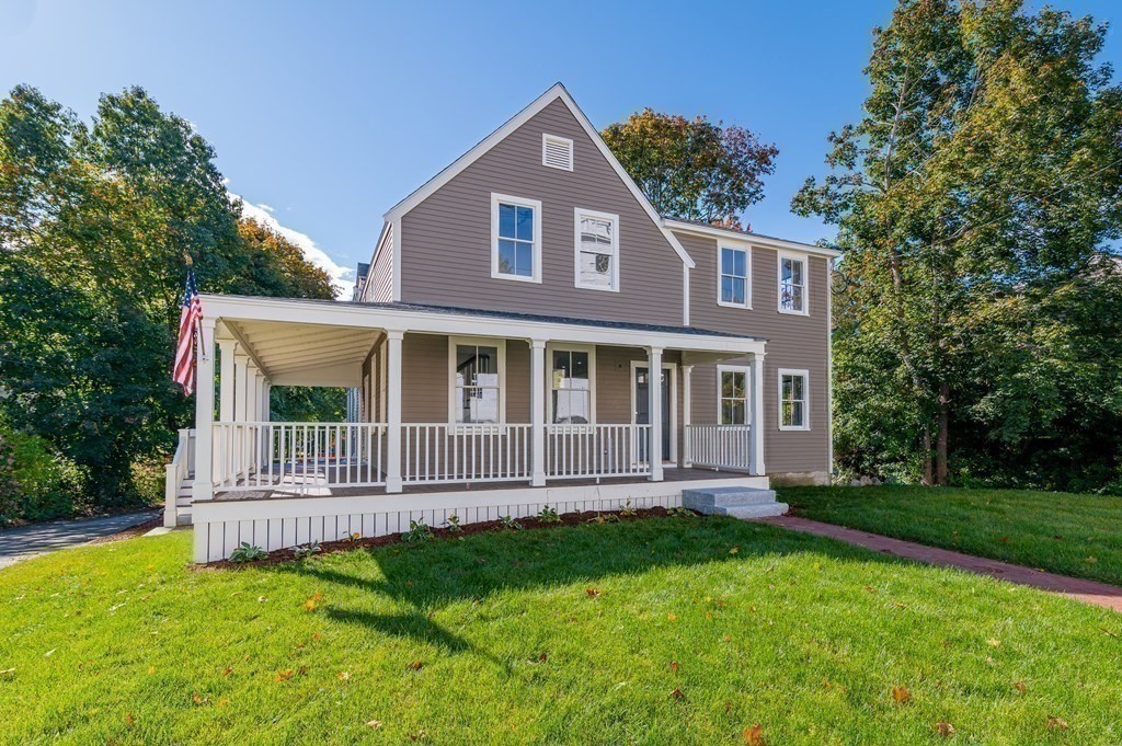 5 Pleasant Street, Unit 3 Hingham, MA 02043 - Photo 20 of 25 a front view of a house with a garden