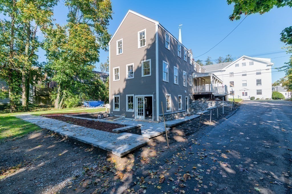 5 Pleasant Street, Unit 3 Hingham, MA 02043 - Photo 21 of 25 a view of a house with a yard